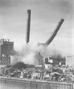 'Ebb' and 'Flo', the chimneys at Prince Rock power station fall during demolition work.